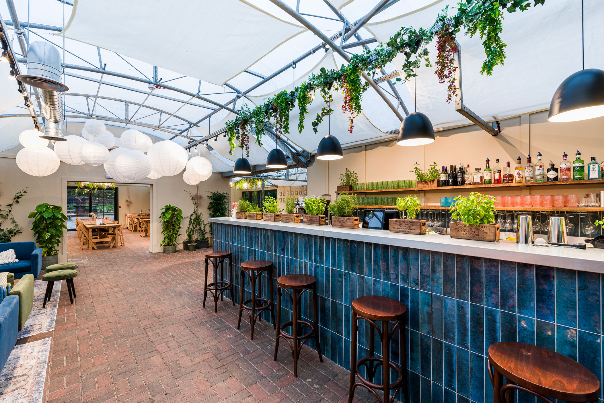 Orangery-style restaurant with sociable dining format and bar stools