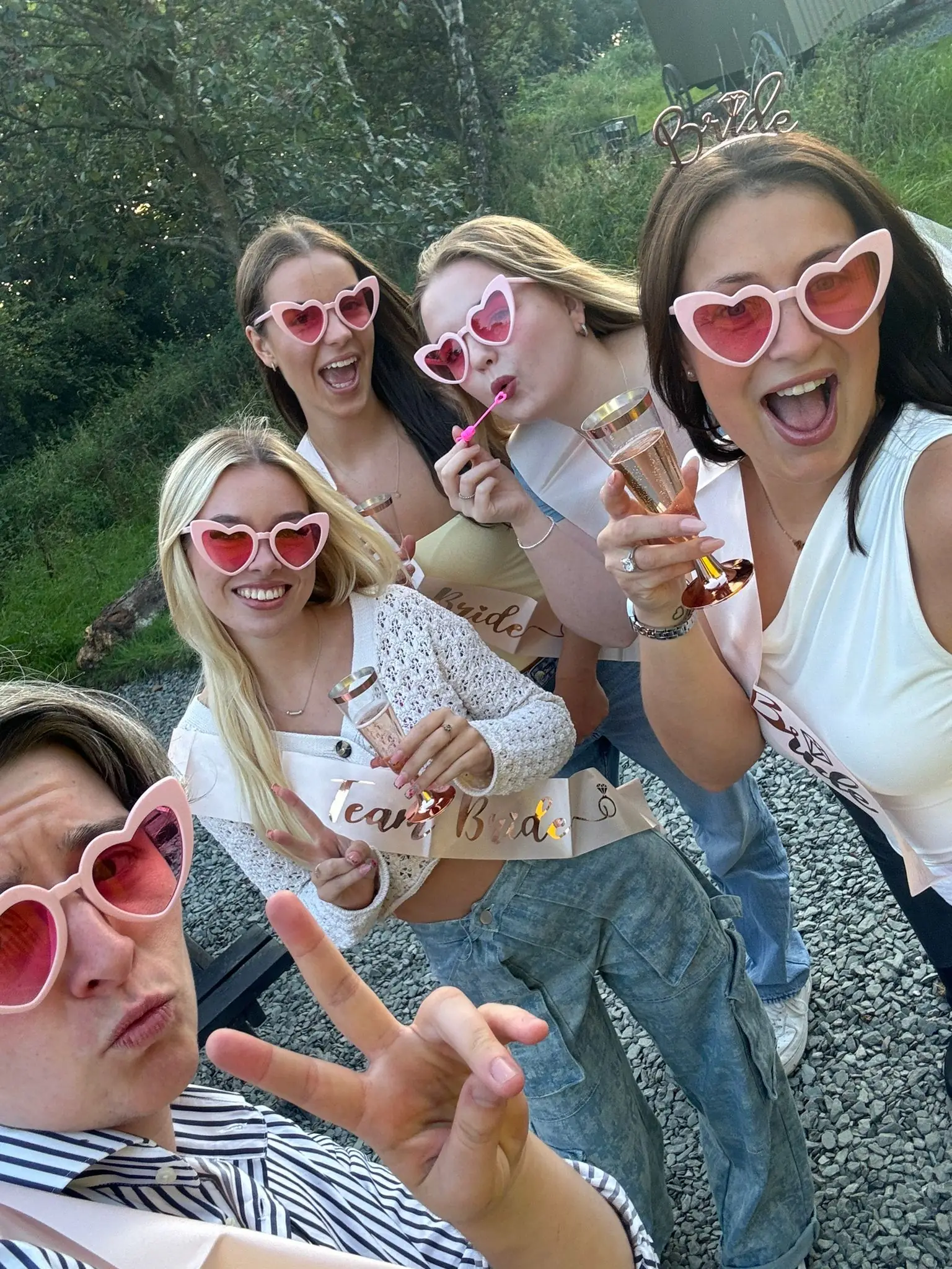 Women wearing comedy glasses on a hen party drinking Champagne