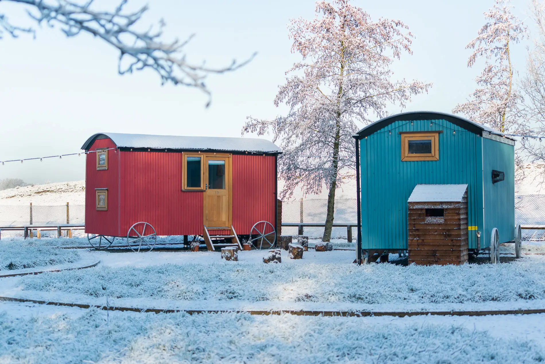 Two shepherd's huts surrounded by snow
